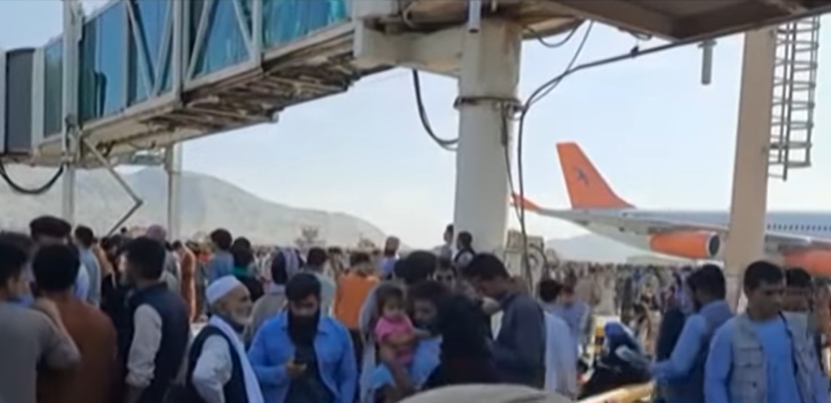 Afghans scramble to the Kabul airport to fly out of the country as the Taliban encircled the capital August 16, 2021.