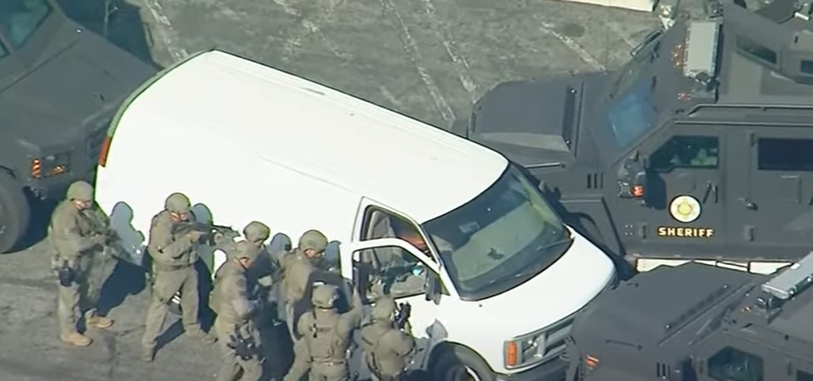 Police search van after 10 people were killed in California massacre. 