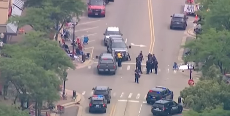 Gunman at large after killing at least 6, wounding dozens at 4th of July parade in Chicago.